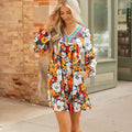 Orange floral print striped lace V-neck long sleeve mini dress on a hanger