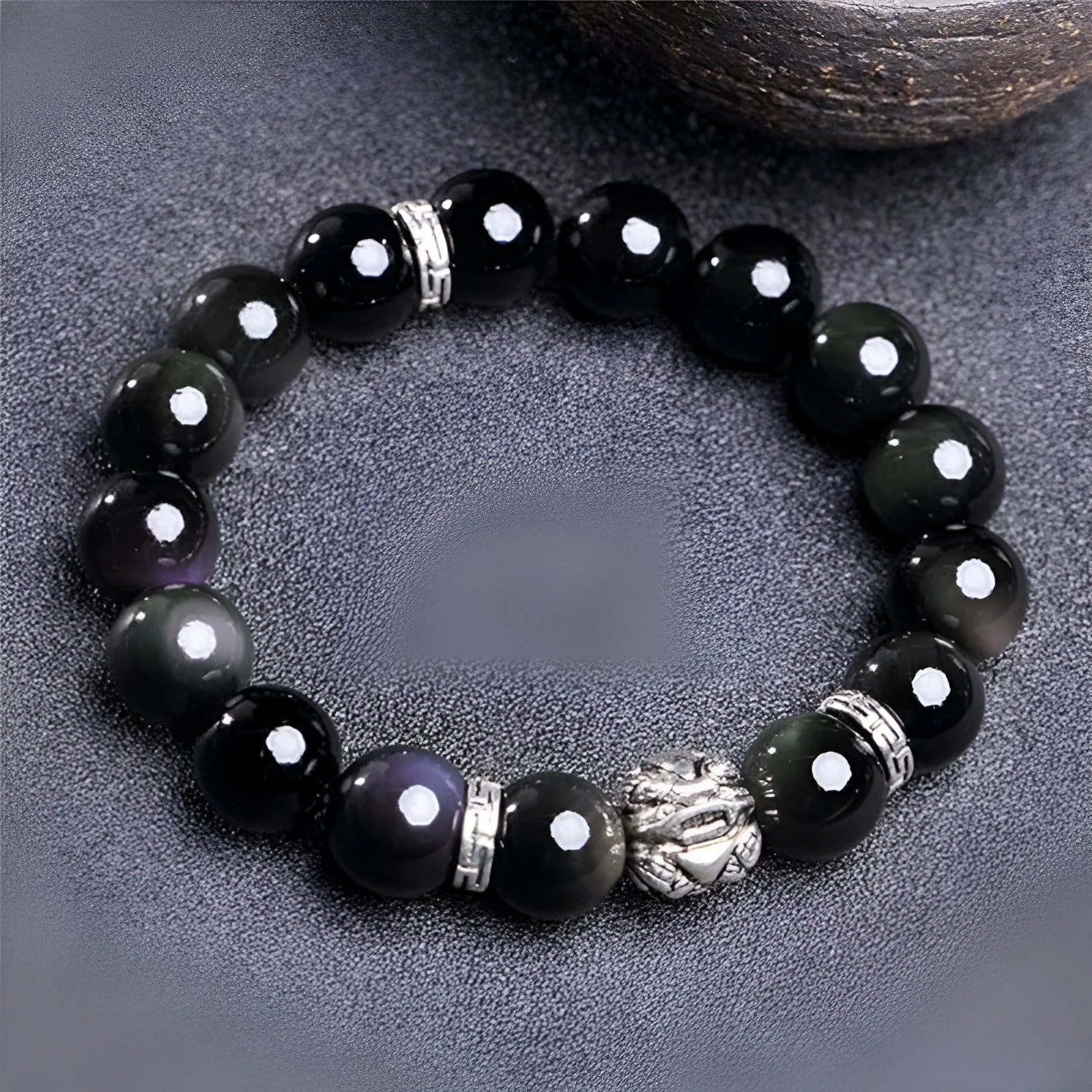 Natural obsidian stone bead bracelet with a silver clasp, shown in male 12mm and female 10mm size options.