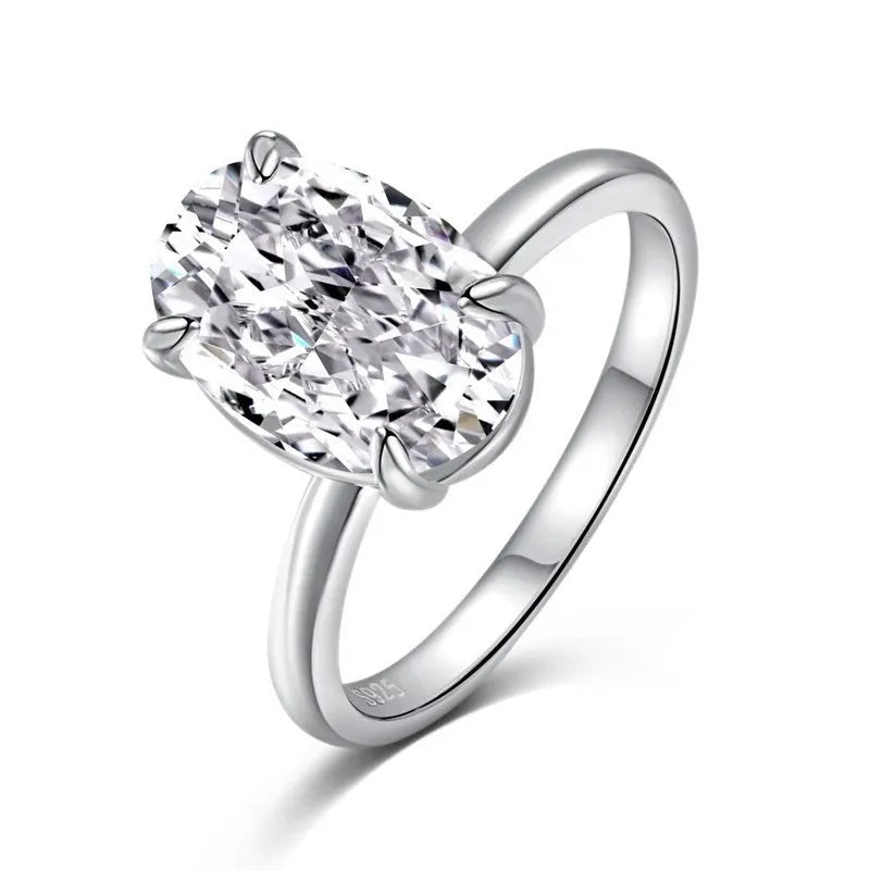 Oval women's silver ring with four-claw setting and cold luxury finish in gold or silver colours