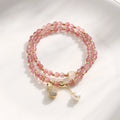Women's strawberry quartz bracelet with geometric wallet-style design and adjustable beaded construction