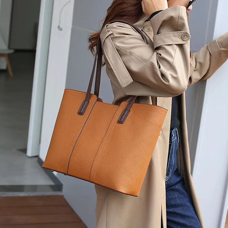 Women's black genuine leather crossbody commuter bag with large capacity and internal organisation compartments