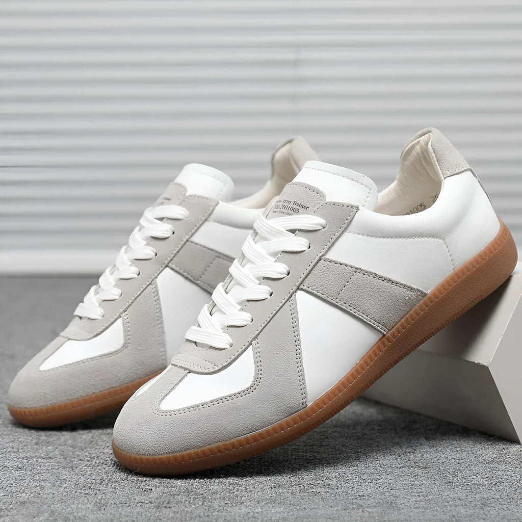 White Japanese-inspired retro unisex sneakers with low-top lace-up design on a rubber sole