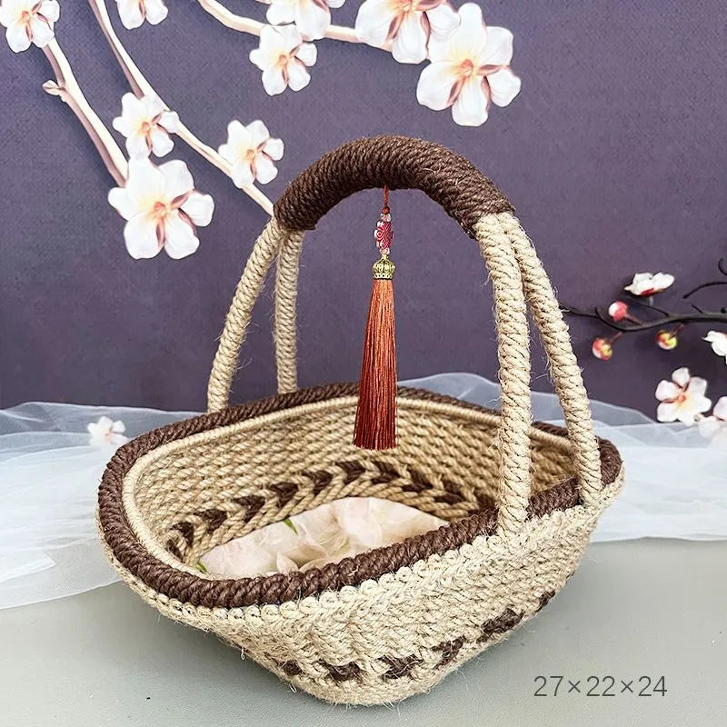 Small hand-woven straw basket in coffee brown colour on a wooden table.