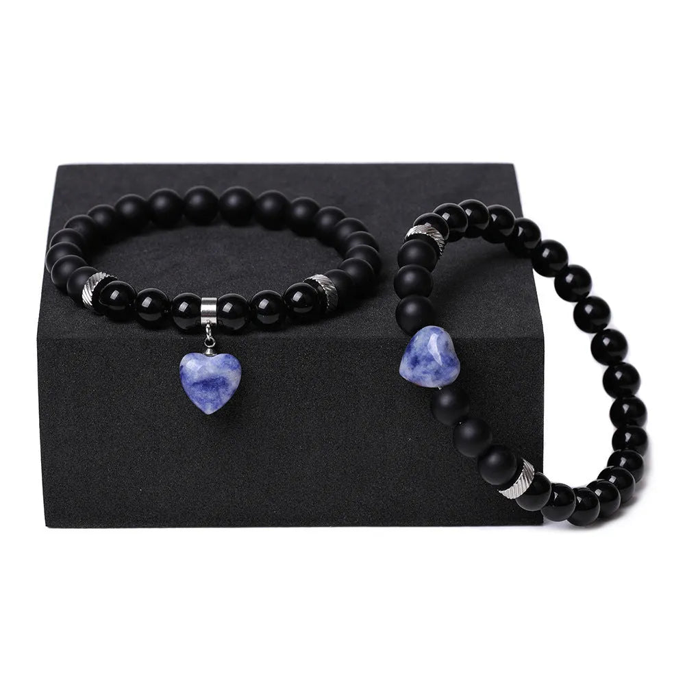 Natural stone couple bracelet set showing two matching bracelets with heart-shaped polished stone charms