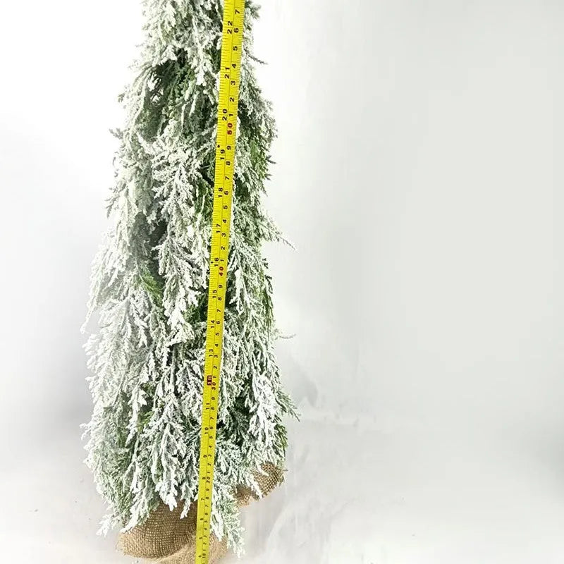 24-inch small artificial Christmas tree with snow spray decoration and built-in lights on desktop