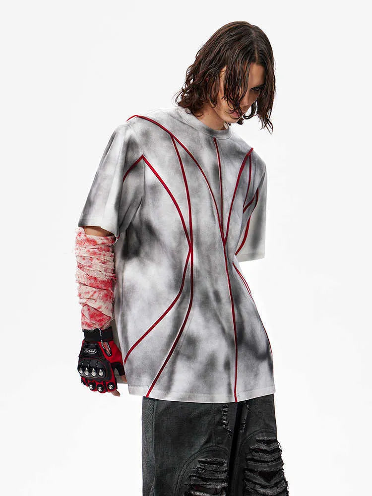 Women's padded shoulder T-shirt with textured line patchwork detail on the front.