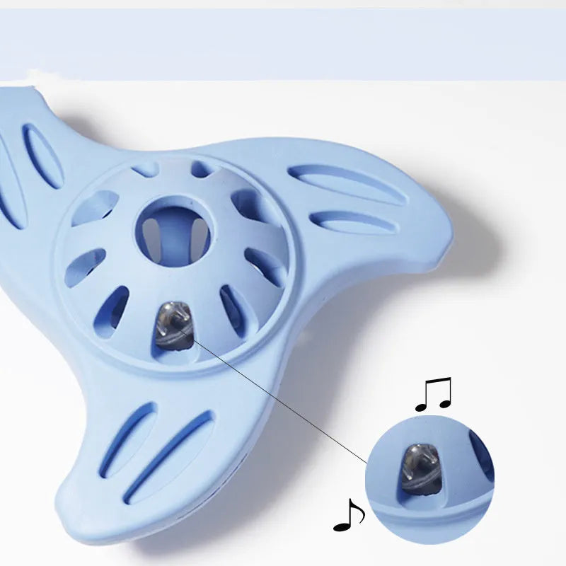Blue boomerang-shaped rubber chew toy for medium and large dogs on a plain background.