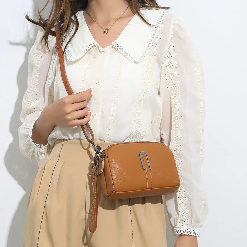 Women's genuine leather square shoulder bag in dark khaki colour, showing structured horizontal shape.