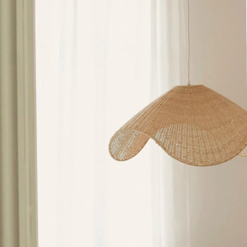 Handwoven straw rattan and willow bamboo pendant ceiling lamp with warm white LED light.