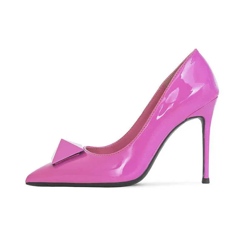 Pink women's pointed toe stiletto high heels with patent leather upper, rivet details, and a buckle.