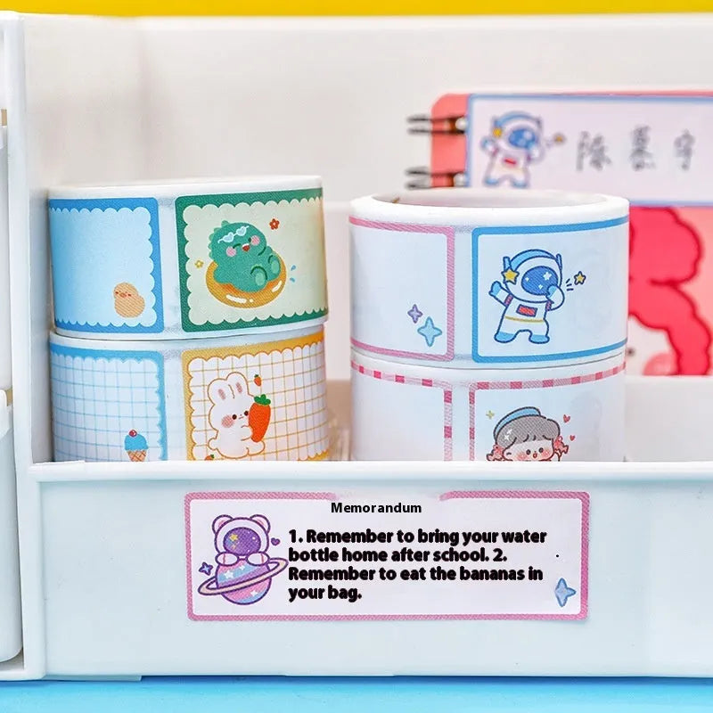 Roll of cartoon name tape stickers showing Dinosaur, Astronaut, Rabbit, and Girl design options.