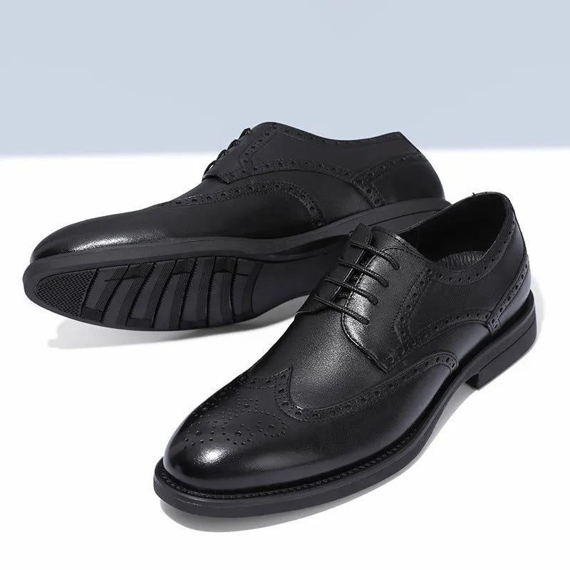 Men's black brogue leather shoes with traditional perforations and Oxford-style construction