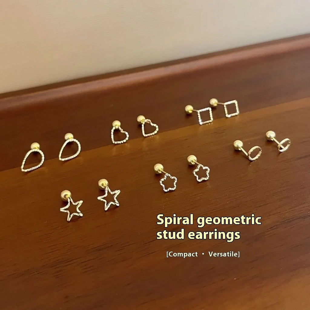 Small spiral geometric ear studs in gold hollow thread design with mixed material build and electroplated finish