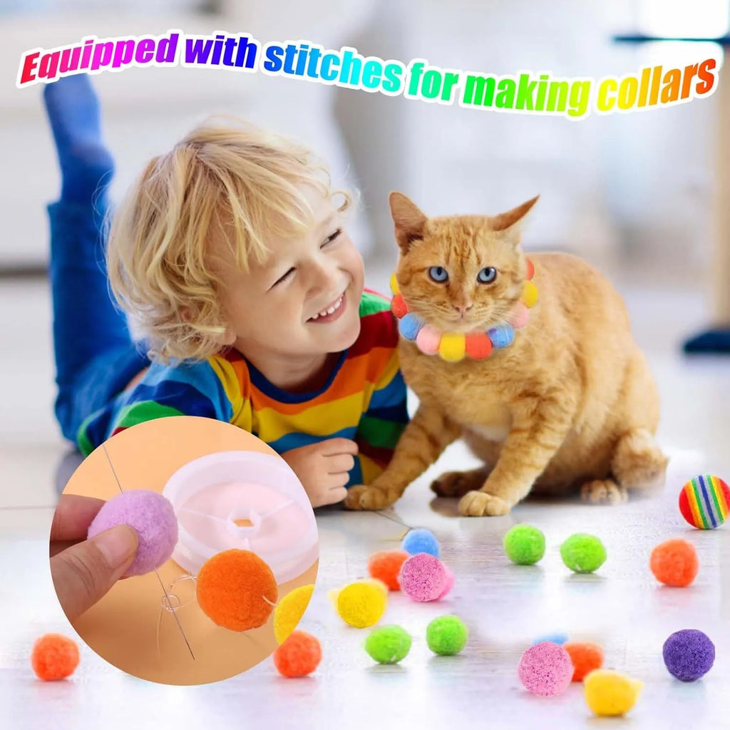 Cat toy ball launcher gun in hand with 20 soft plush pom pom balls for interactive fetch play