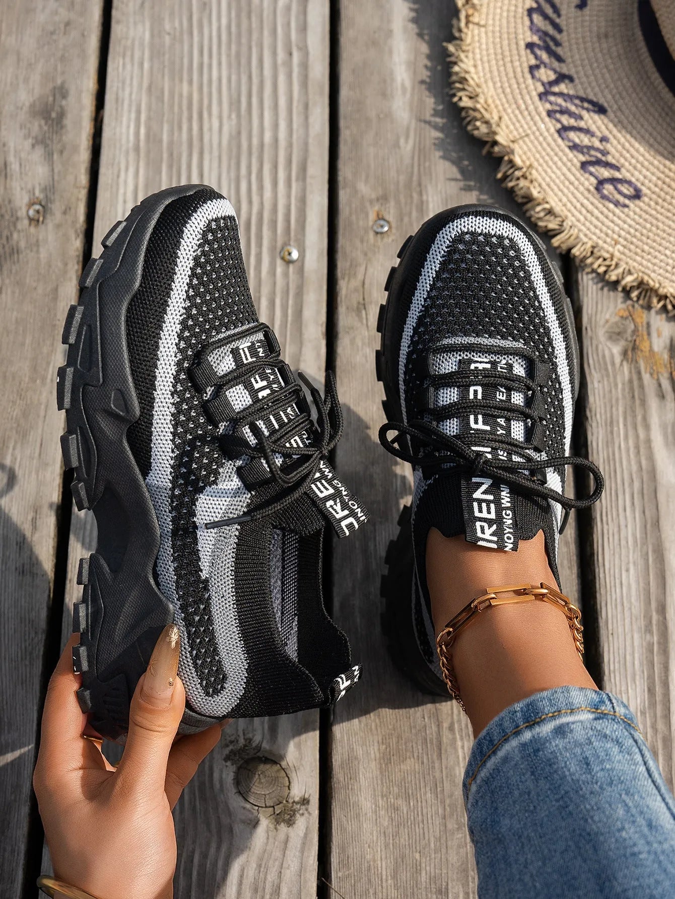 Women's Flyknit Mesh sneakers in a neutral colour showing lace-up design and rubber sole.