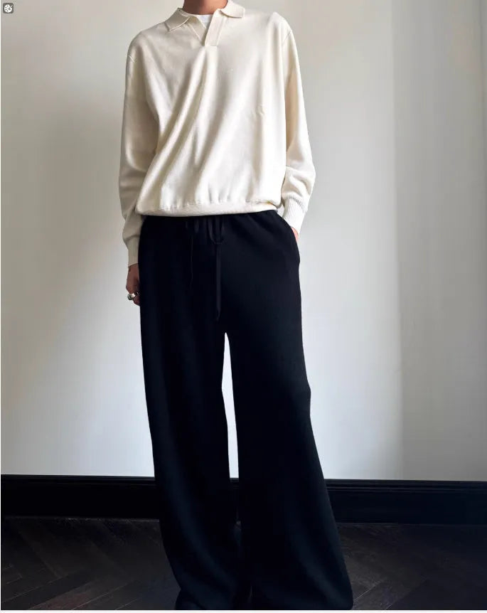 Man's pure wool polo sweater with a lapel collar in a loose fit, shown in navy blue.