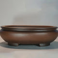Purple clay handmade classical desktop flowerpot measuring 58 cm long by 47 cm wide.