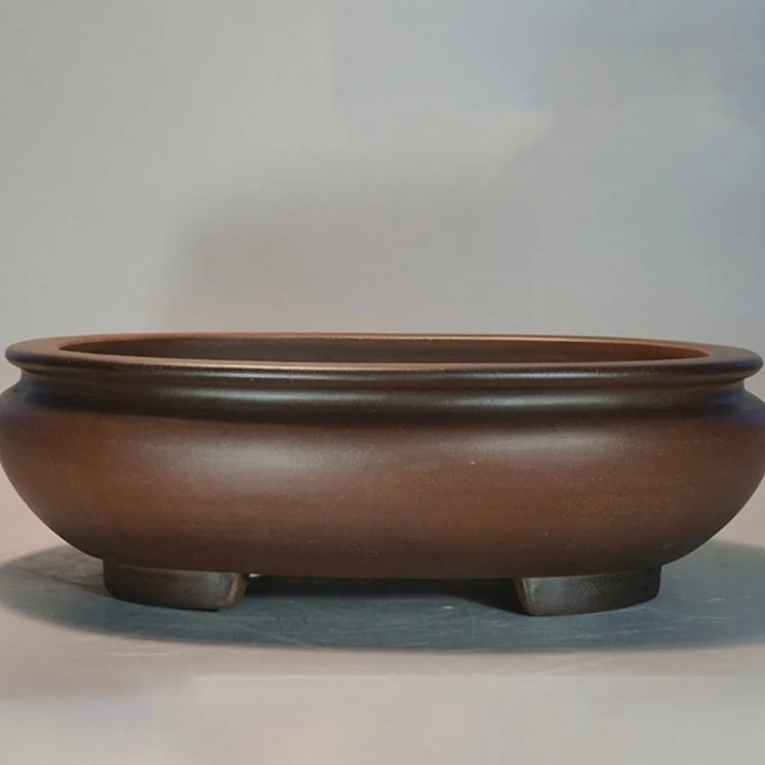 Purple clay handmade classical desktop flowerpot measuring 58 cm long by 47 cm wide.