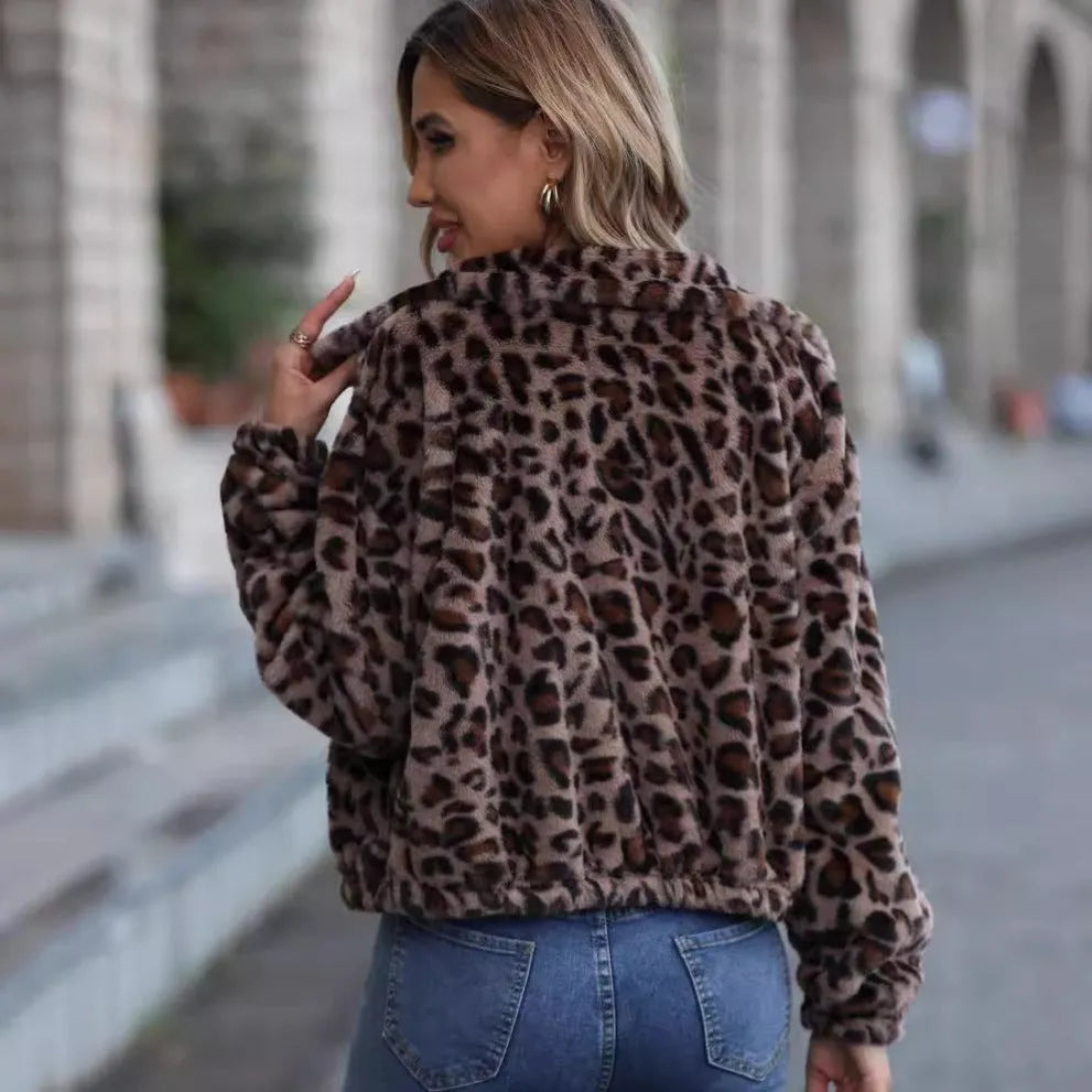 Women's loose-fit leopard print plush coat with a zip front and raglan sleeves laid flat.