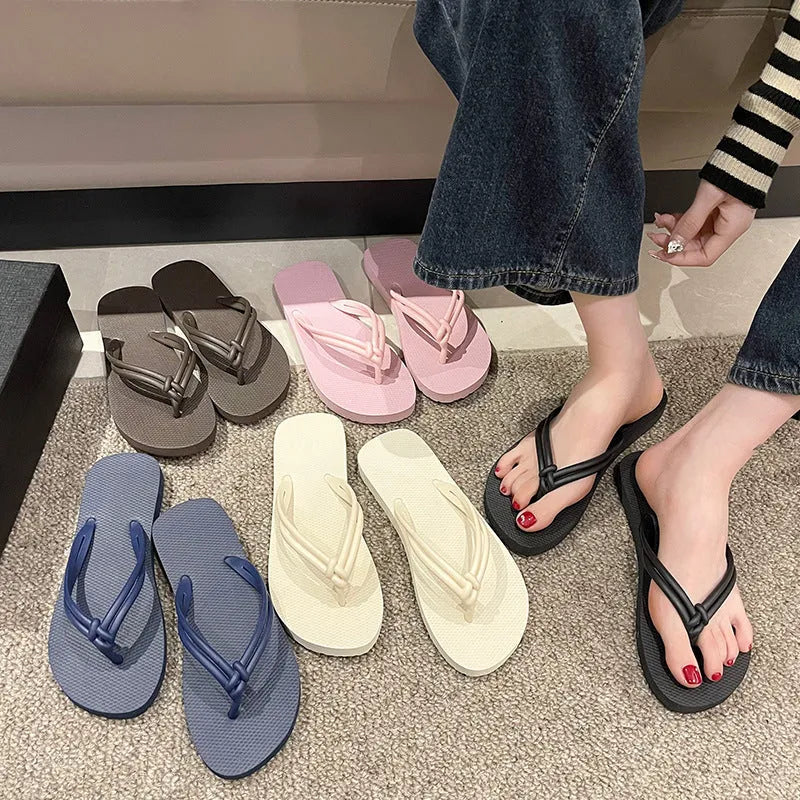 Women's PVC flip flops with toe-covering style and non-slip sole in multiple colours.