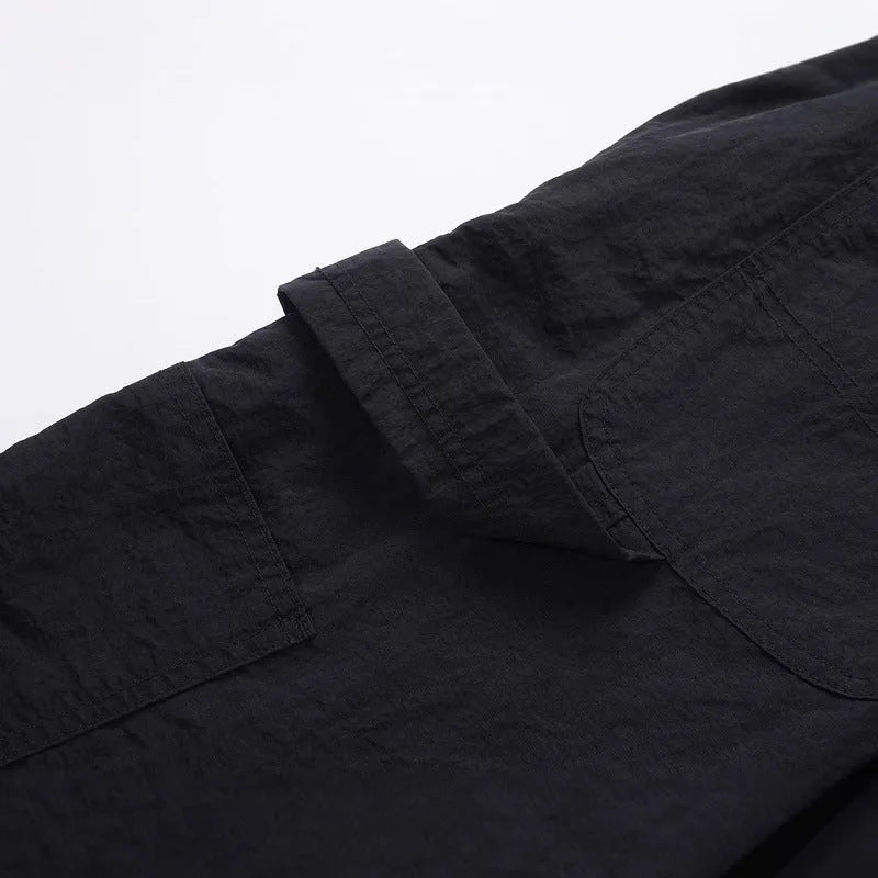Black paratrooper pants with elastic waist, three-dimensional cutting, and baggy fit