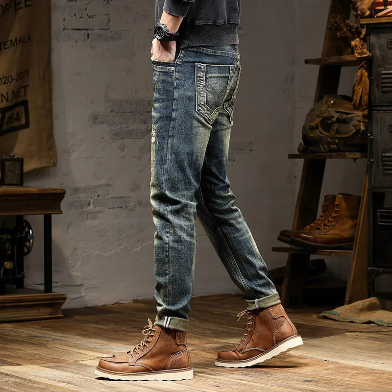 Men's skinny fit stretch jeans in a retro colour, showing zip fly and slim leg cut.