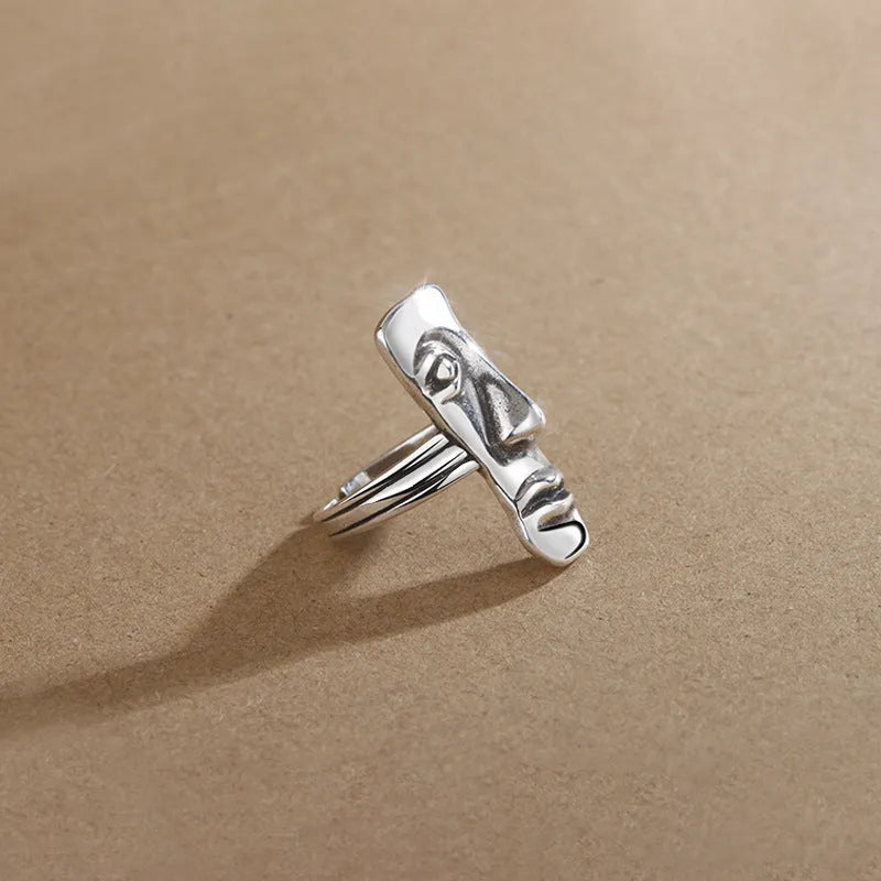 Copper retro half face mask ring with electroplated finish and adjustable opening on a neutral background.