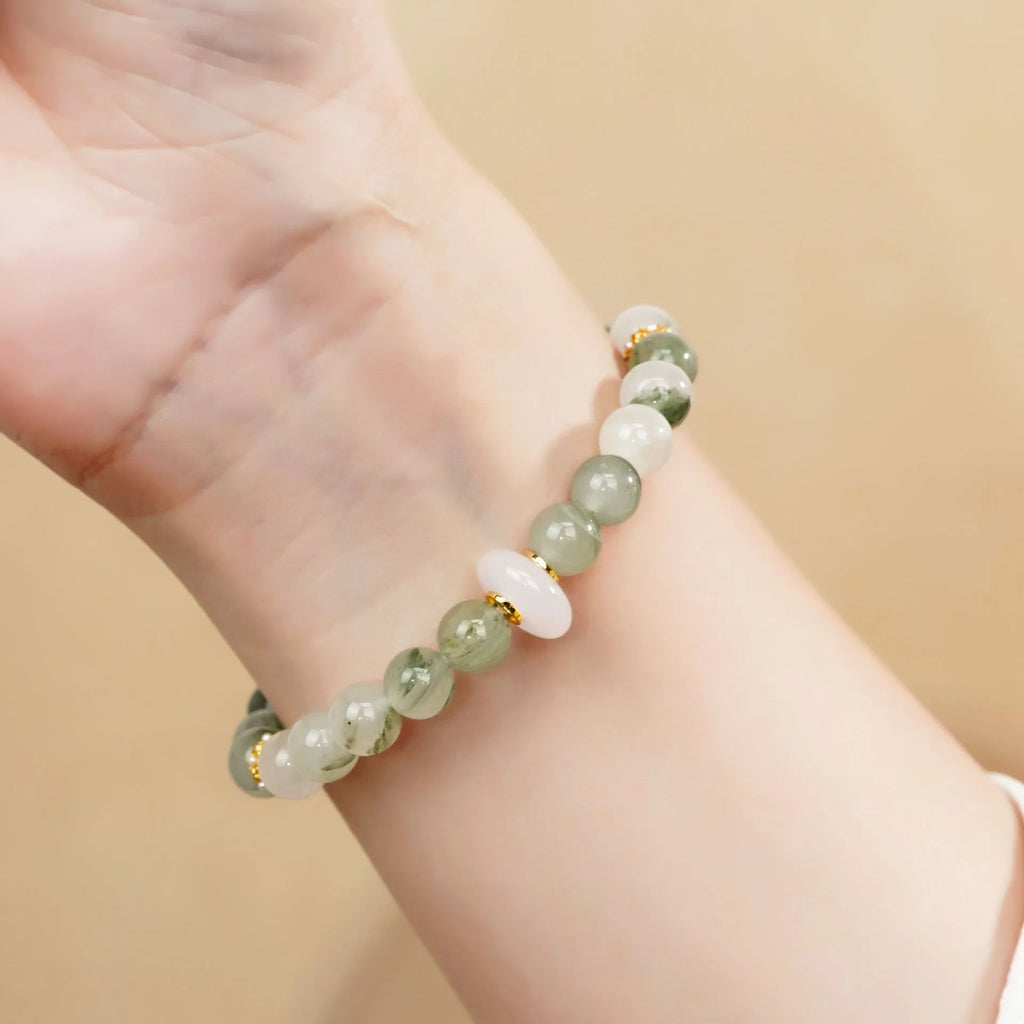 Emerald green jade bracelet with floating flower girl design in a half bracelet style.
