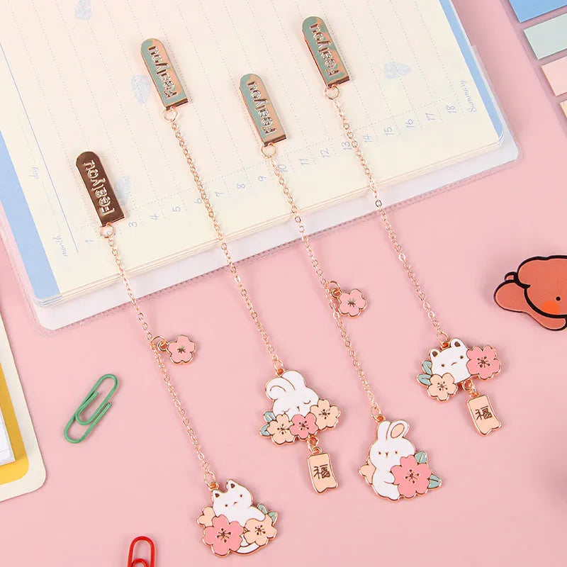 Creative cartoon metal pendant bookmark featuring cherry blossom cat and rabbit designs.