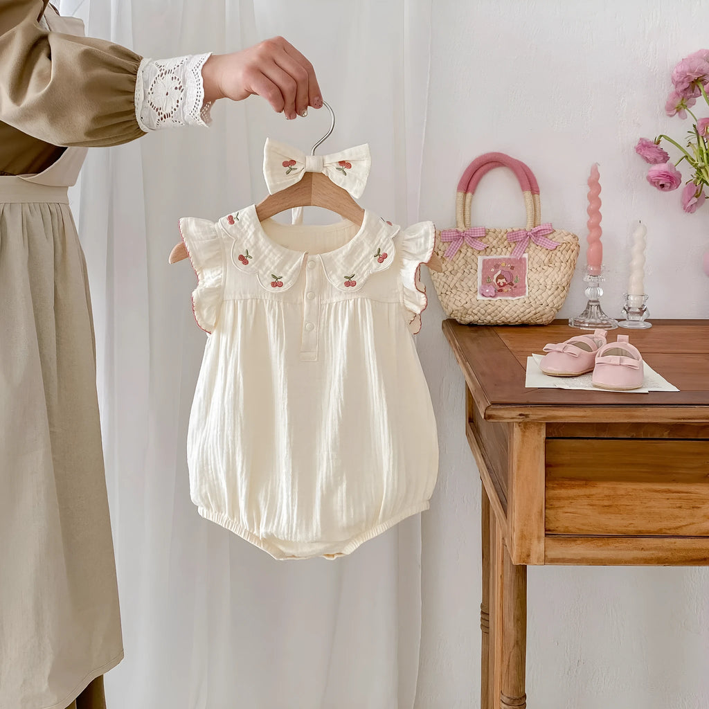 apricot cotton sleeveless double breasted baby jumpsuit with matching hair band