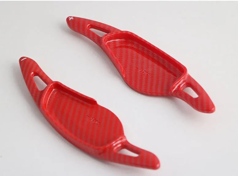 Steering wheel paddle shifter modification kit with carbon fibre pattern on black background