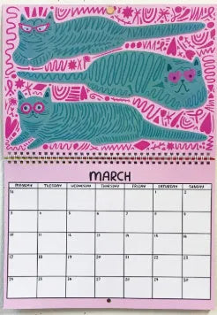 Cat Calendar Wall Planner for 2024 or 2025 with seasonal designs on paper.