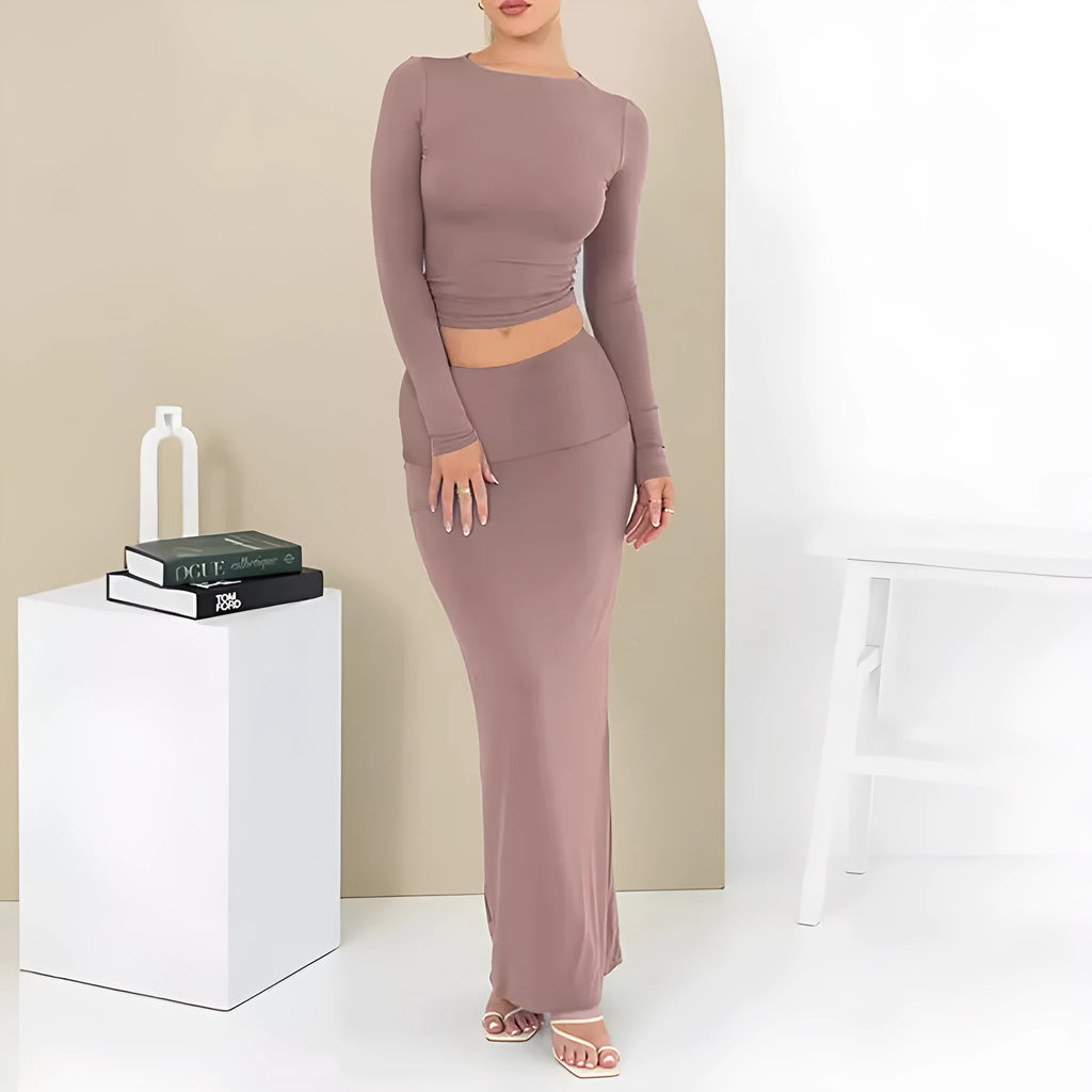 Women's black polyester two-piece suit with waist-exposing top and long skirt