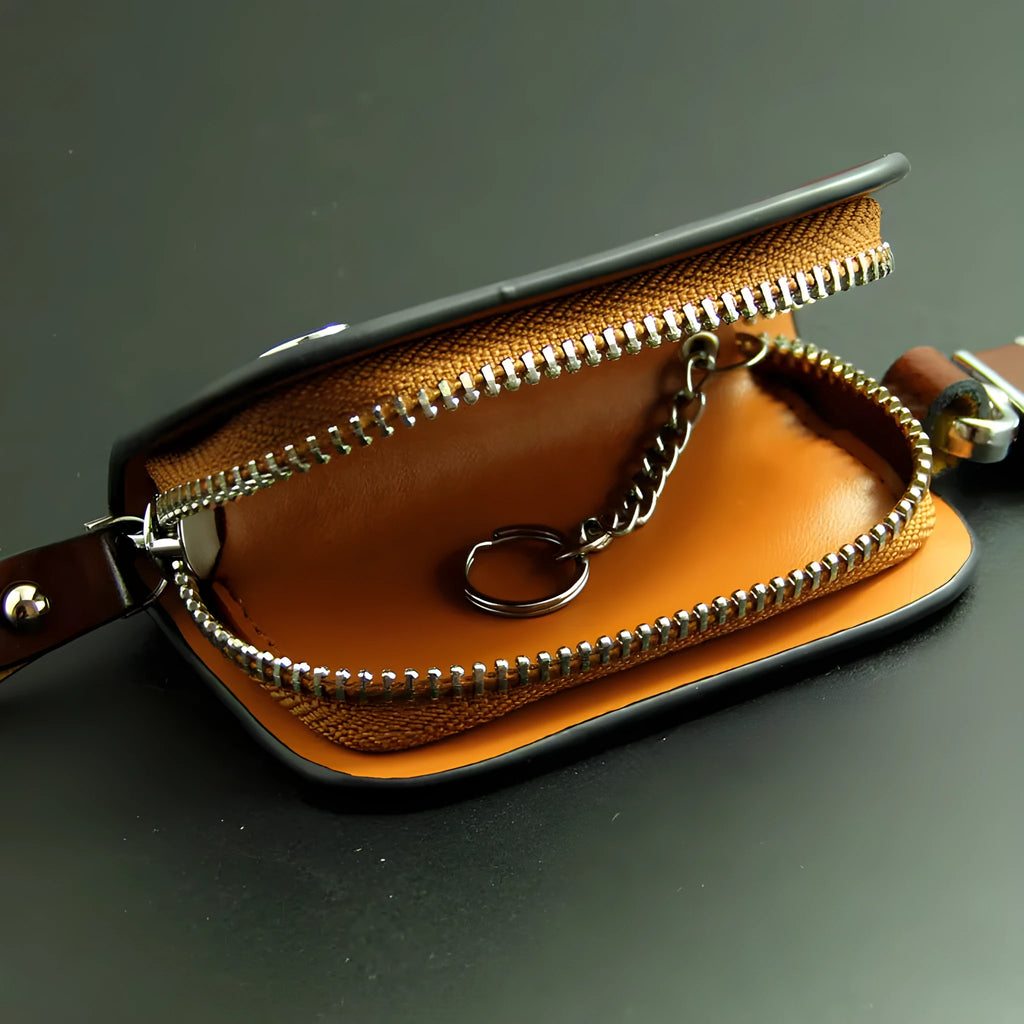 Genuine leather car key case with zipper in black and brown frosted finish.