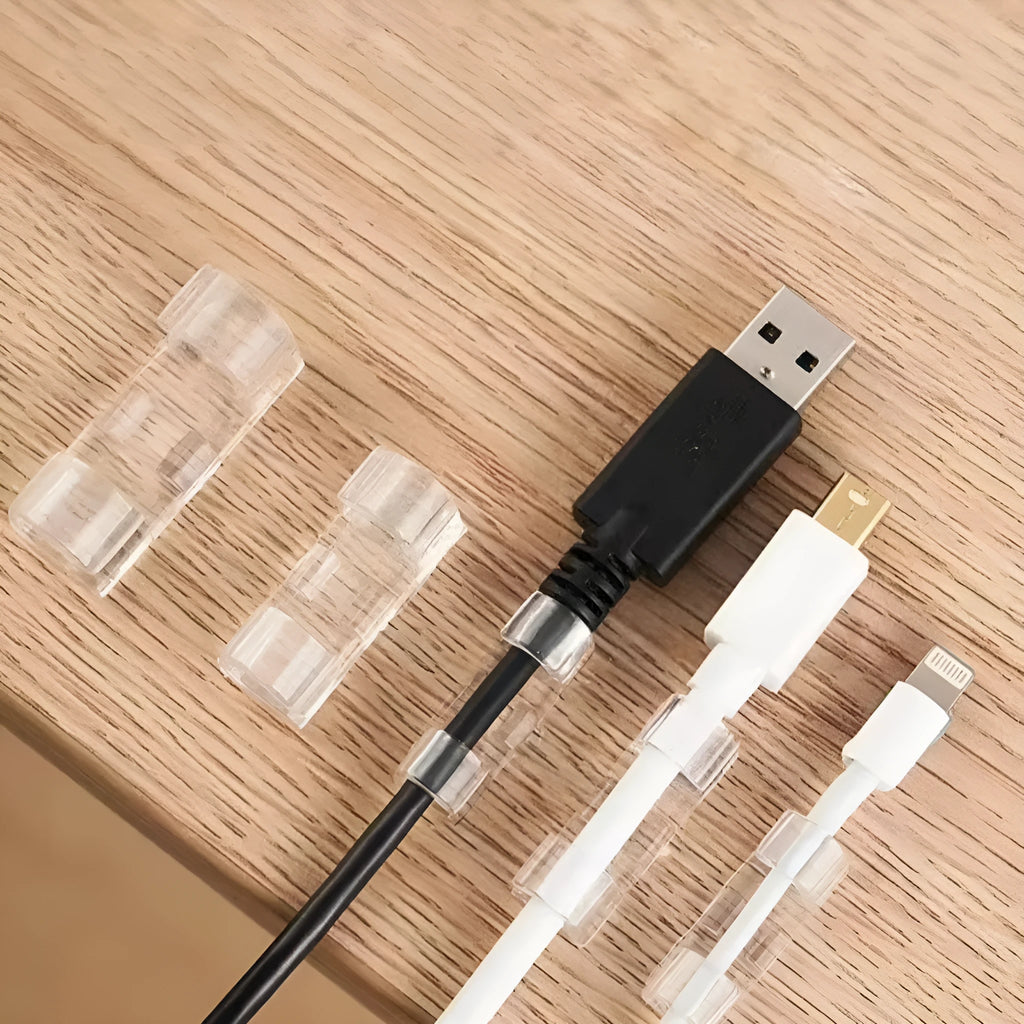 Transparent plastic self-adhesive wire routing clips for cable organisation