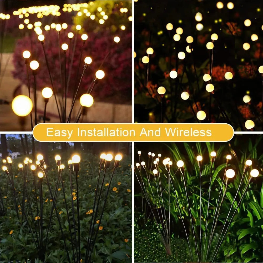 Solar-powered LED firefly lawn light with ground stake inserted in grass