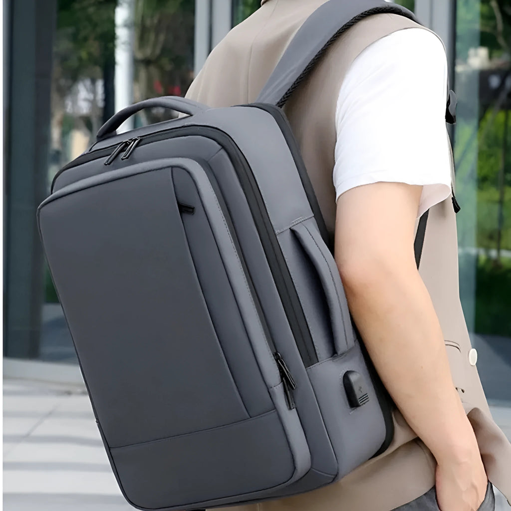 Black waterproof Oxford cloth backpack with curved shoulder strap and business styling