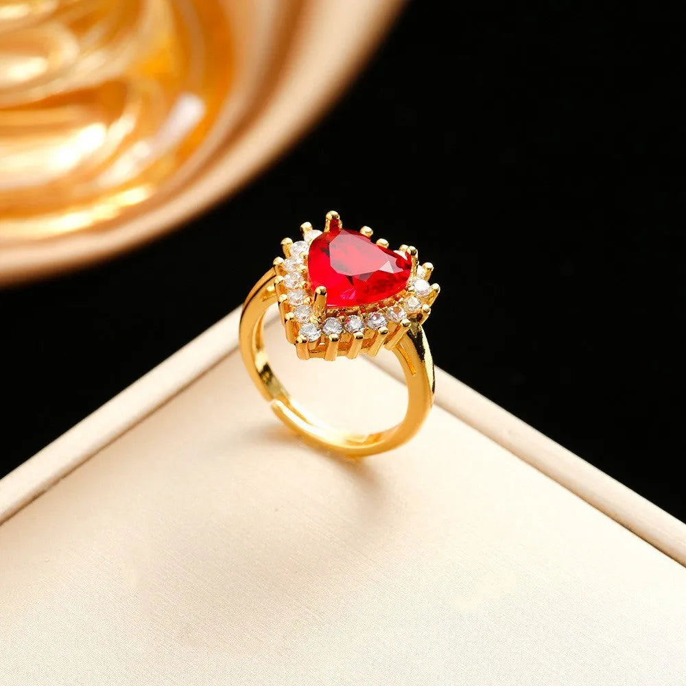 Gold red titanium steel jewellery set with heart flower pendant, matching earrings and ring