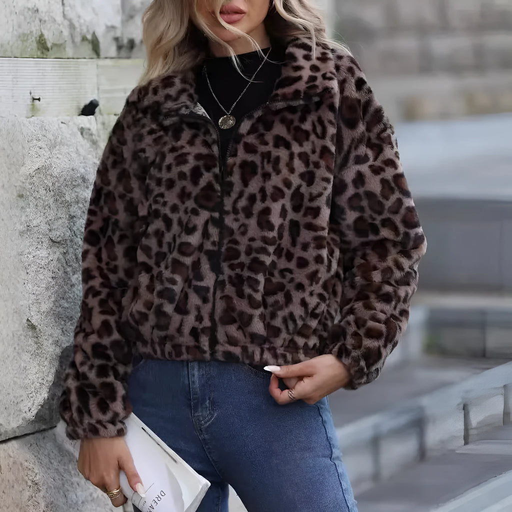 Women's loose-fit leopard print plush coat with a zip front and raglan sleeves laid flat.