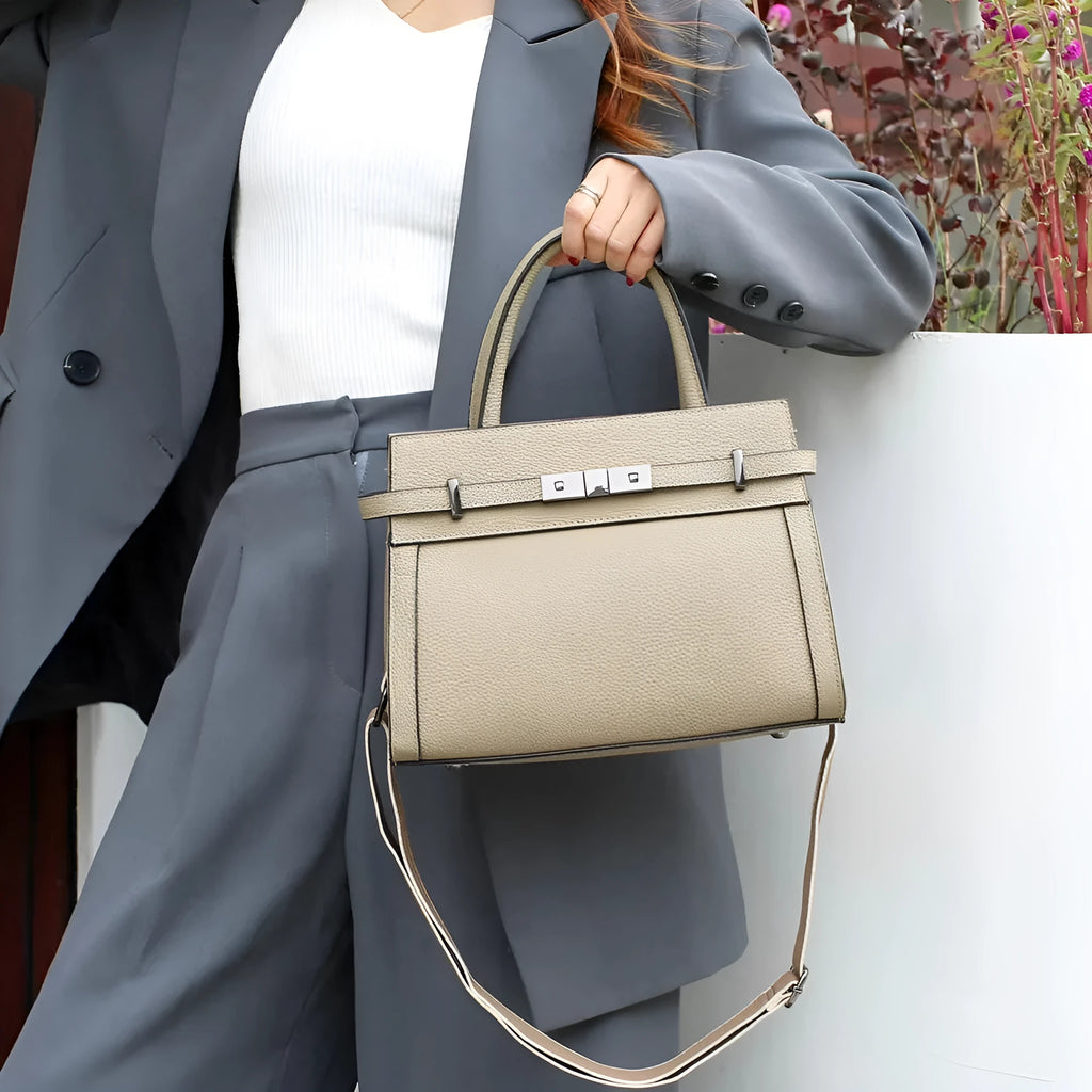Small square genuine leather shoulder bag in neutral colour with internal organisation compartments