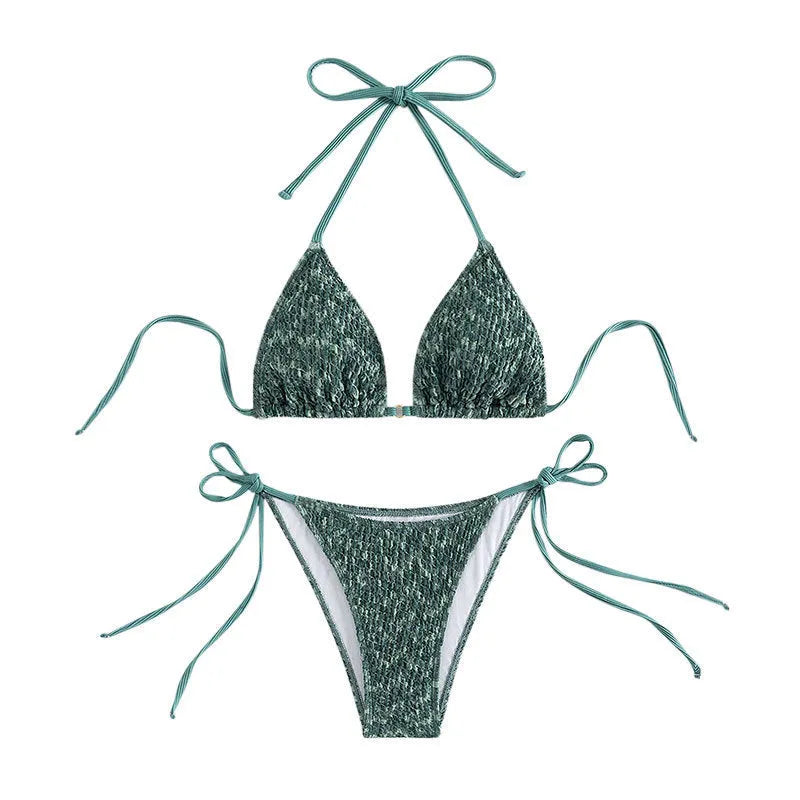 Women's green halter strap backless swimsuit set with three-point design and matching shorts