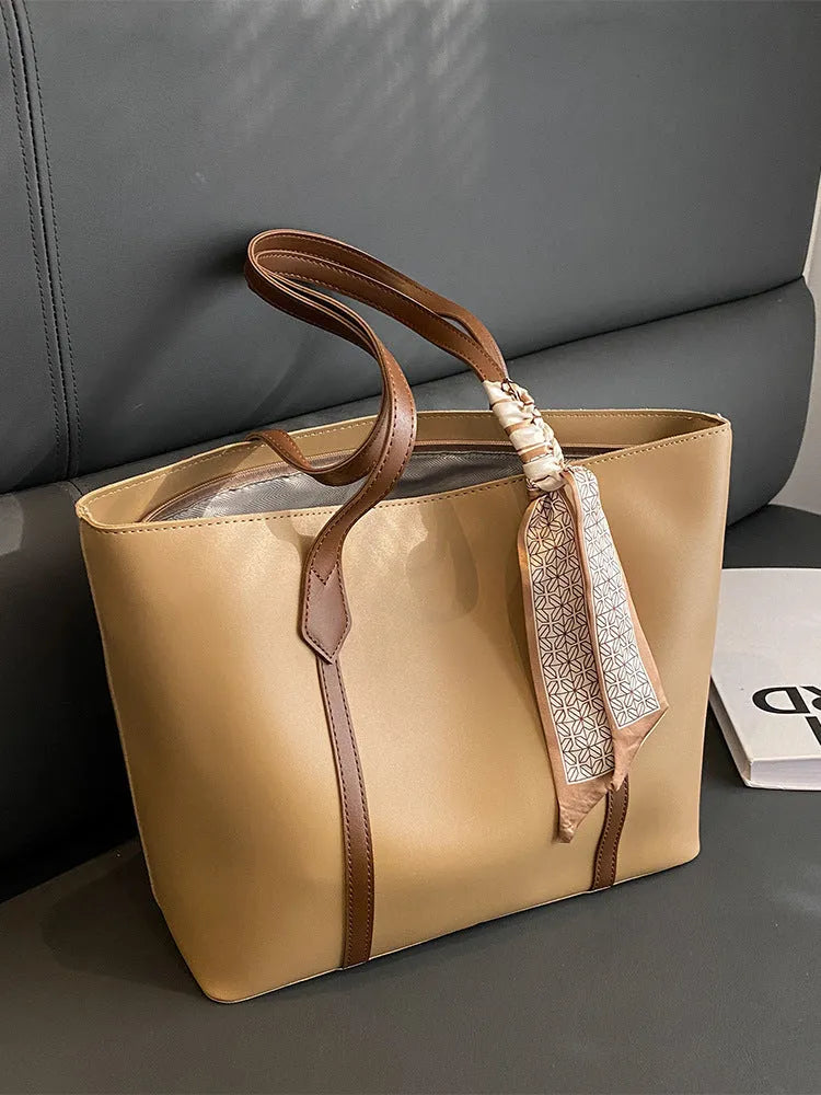 Women's soft large tote bag in a chosen colour, showing outer pockets and sewing detail.