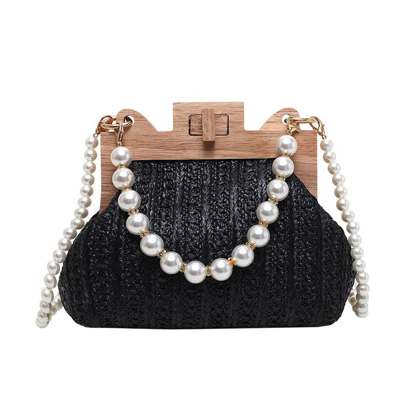 Beige woven straw women's shoulder bag with pearl chain detail, showing interior zipper pockets.