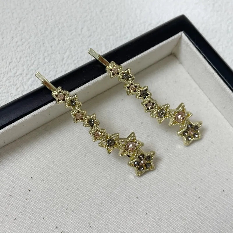 Gold-coloured rhinestone barrette clip with star charm for bangs