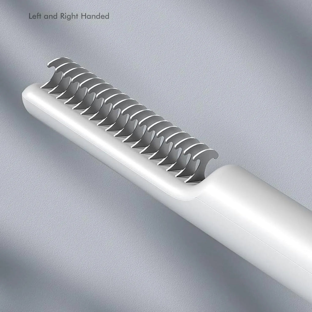 Stainless steel dog dematting comb with ergonomic handle on a white background