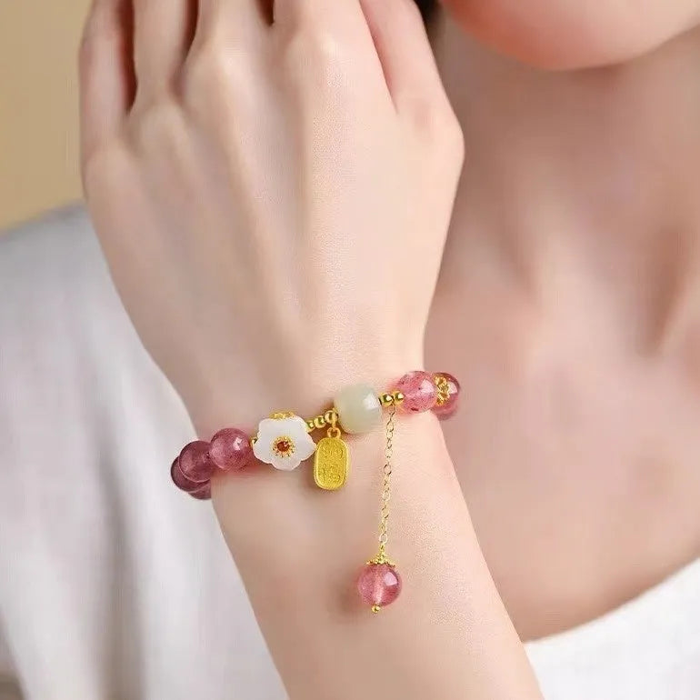 Handmade strawberry quartz crystal bracelet with hetian jade peach blossom elements in five style variations
