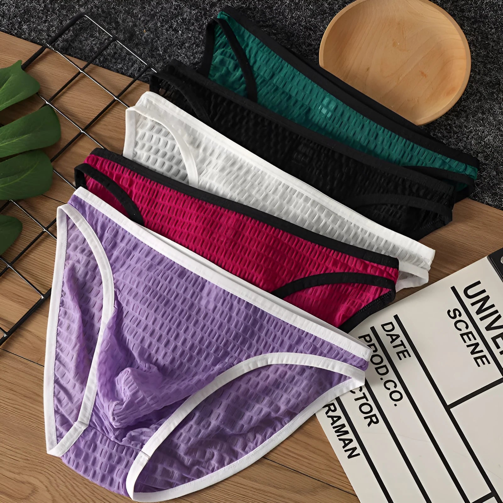 Men's low waist transparent visual underwear in nylon lace fabric showing breathable quick-drying construction