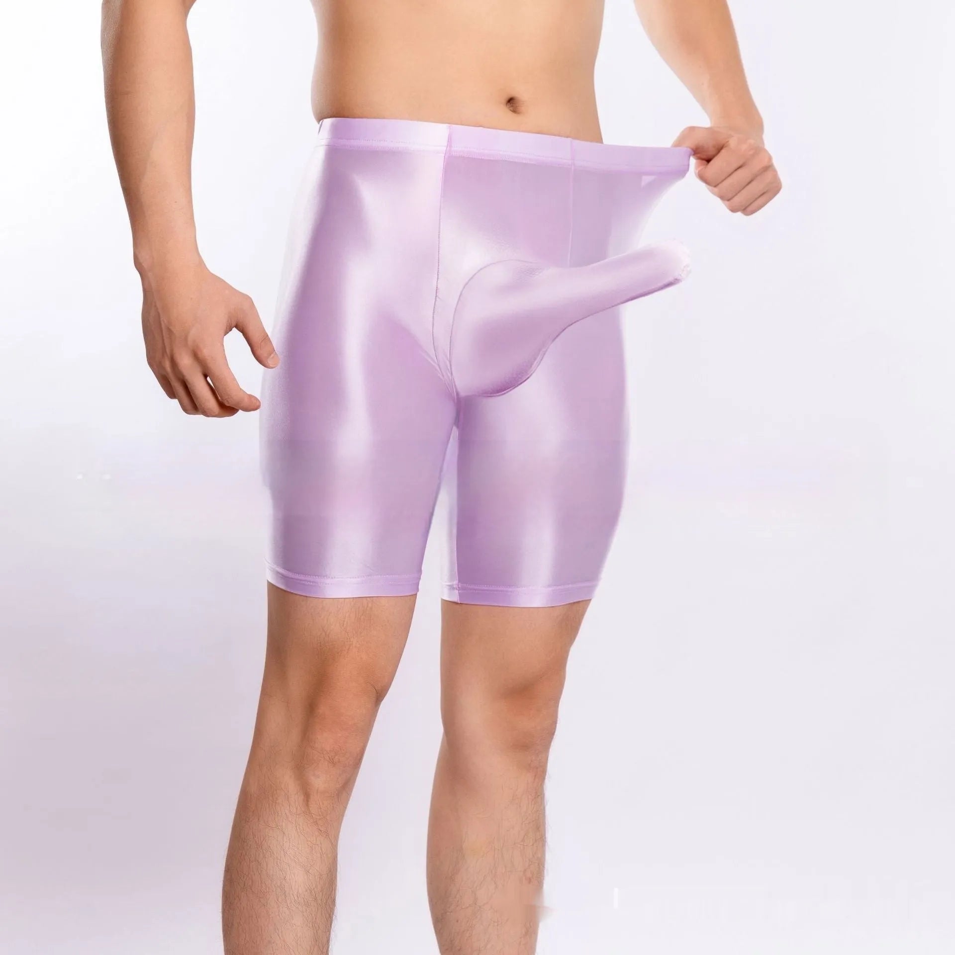 Man wearing shiny black plus size nylon sports shorts, showing silky finish.