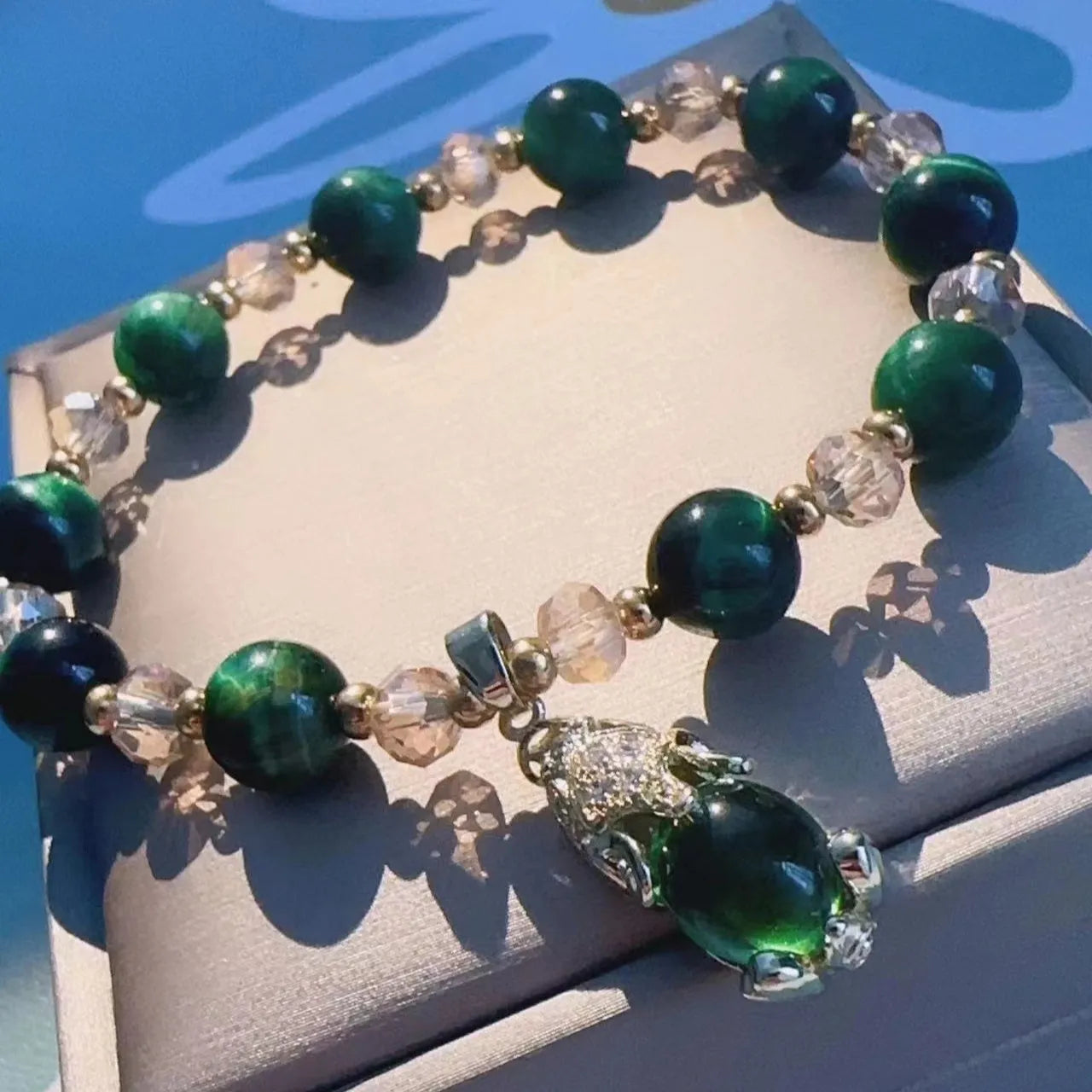 Handmade natural Tigereye stone bracelet with Vanves stone centre, shown in single and double chain designs.