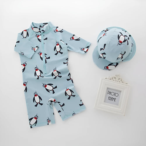 Boy's penguin print swim set with long sleeves and matching swimming cap for ages 2-7 years
